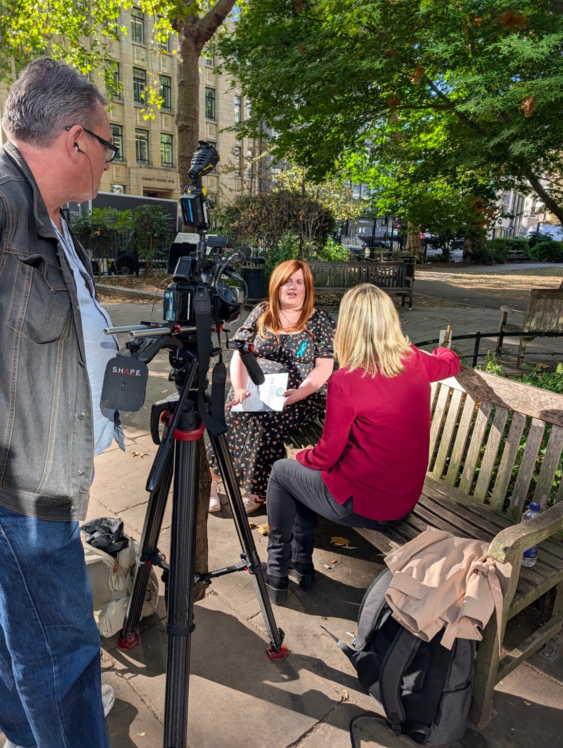 An outdoor television interview about No More Falls during the campaign visit to Holborn